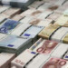 Wads of euro banknotes are stacked in a pile at the GSA Austria (Money Service Austria) company's headquarters in Vienna July 22, 2013. REUTERS/Leonhard Foeger