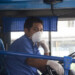 A bus driver wears a protective mask as a preventive measure against the spread of the COVID-19 Coronavirus, at a transfer station in Quito, on March 13, 2020. (Photo by Rodrigo BUENDIA / AFP)
