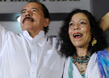 Nicaraguan President Daniel Ortega (L) celebrates with First Lady Rosario Murillo after receiving the credentials in Managua on January 9, 2012, a day before his re-inauguration. AFP PHOTO/Rodrigo ARANGUA (Photo credit should read RODRIGO ARANGUA/AFP/Getty Images)