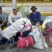 Venezuelan migrants hoping to return to their country because of the novel coronavirus COVID-19 pandemic, wait in the streets of Bogota to be authorized to leave, on April 29, 2020. - Hundreds of Venezuelans have been unable to leave Bogota due to the protocols established by Colombian Migration, who said the return to their country will be in a controlled way, with a limit of daily departures. To this day, nearly 12,000 Venezuelan citizens have returned to their country since the outbreak of the pandemic, said the authorities. (Photo by Raul ARBOLEDA / AFP)