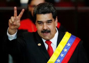 FILE PHOTO: Venezuelan President Nicolas Maduro gestures after receiving the presidential sash during the ceremonial swearing-in for his second presidential term, at the Supreme Court in Caracas, Venezuela Jan. 10, 2019. REUTERS/Carlos Garcia Rawlins/File Photo