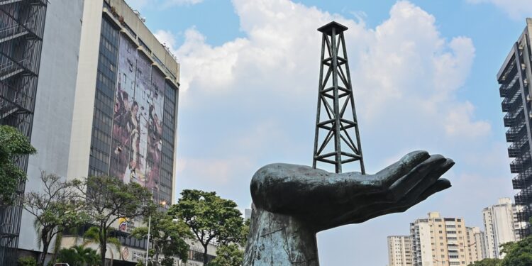 View of the "Peace Monument" sculpture outside the headquarters of Venezuelan state-owned oil company PDVSA, in Caracas, on April 22, 2020. - The OPEC alliance of oil producers said "several" member states, and some of its allies in the OPEC+ grouping, held a teleconference Tuesday to discuss the plunge in oil prices caused by the coronavirus pandemic. The organisation tweeted that ministers held an "informal teleconference to brainstorm the current dramatic oil market situation" but it was not clear whether Saudi Arabia, OPEC's largest producer, took part. A photo tweeted by the organisation appeared to show representatives from countries including Nigeria, Iraq and Venezuela taking part but there was no confirmation of which countries joined the meeting. (Photo by Federico Parra / AFP)